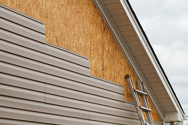 Professional Siding Replacement technician working in Woodland, PA